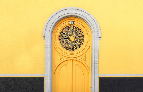Ornate yellow door and yellow wall
