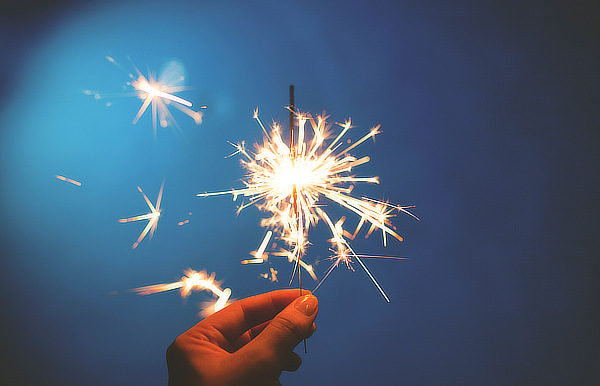 Hand holding a sparkler