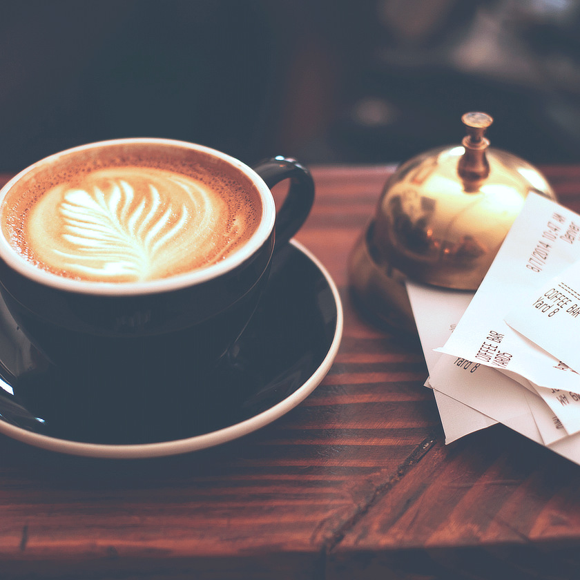 Photo: Mug of espresso next to a service bell